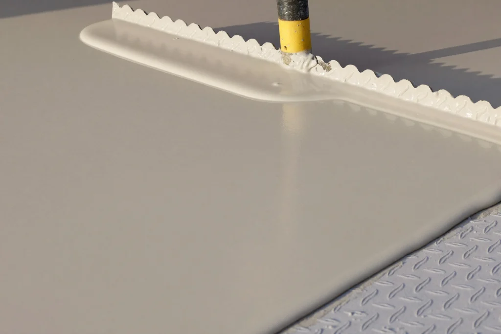 Matte self-levelling epoxy pour with a notched trowel