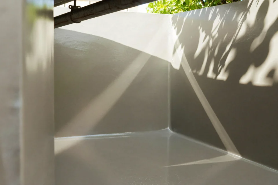 Chemical-resistant epoxy lining a concrete bund floor and wall