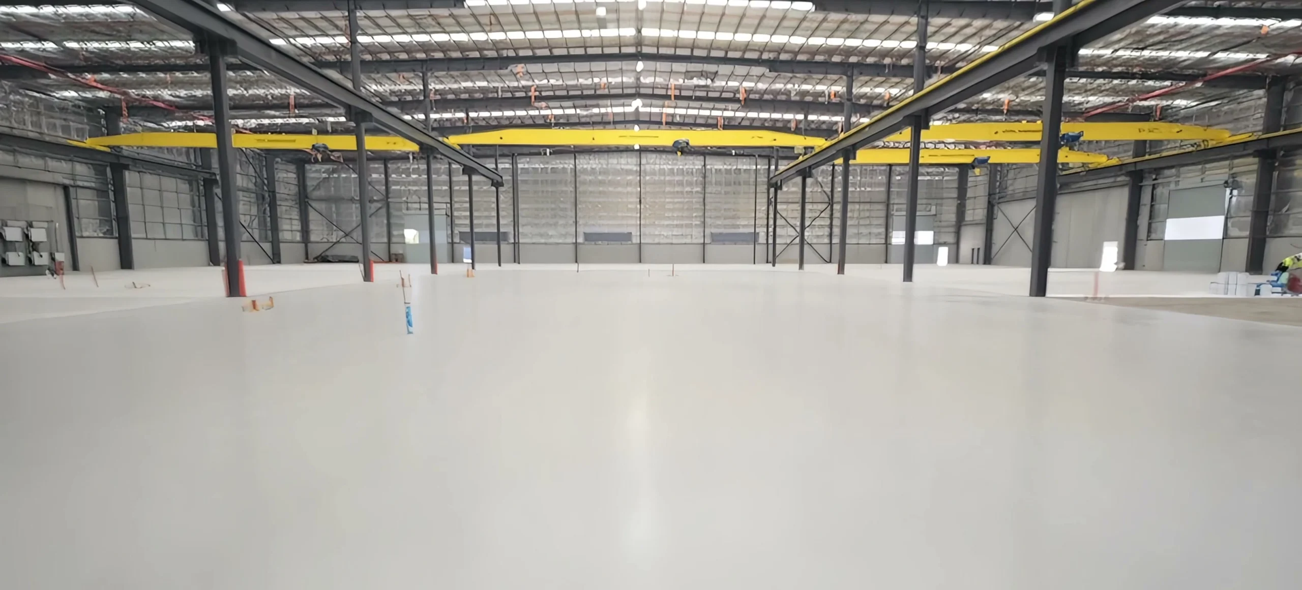 The finished self-levelling epoxy floor under the gantry cranes at the new Bosch Rexroth facility