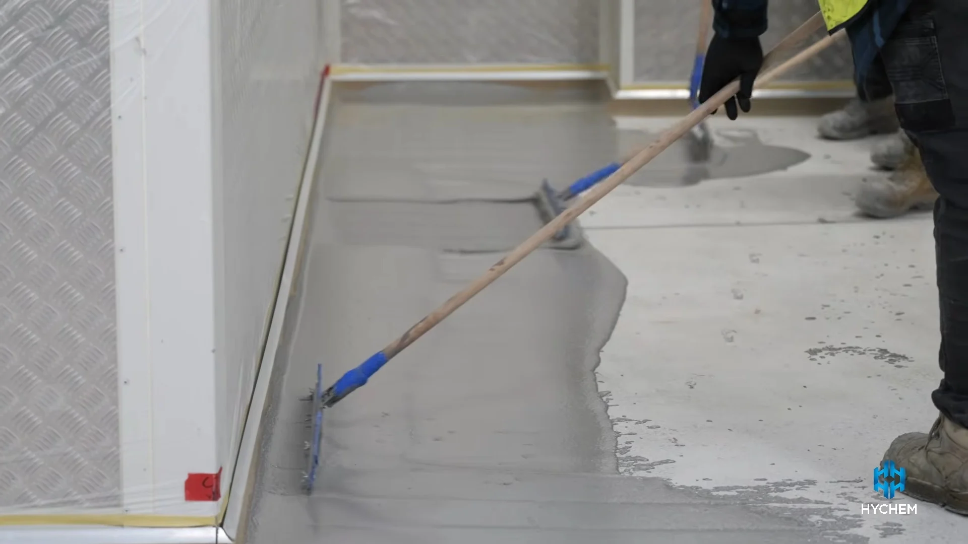 Coving being formed at the floor–wall junction